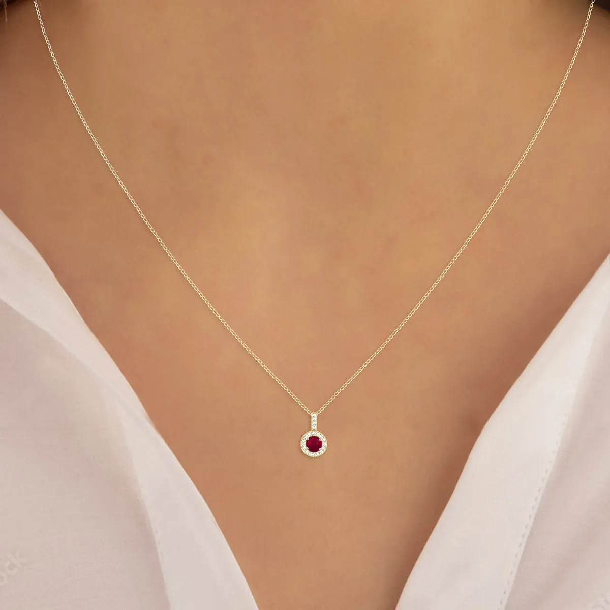 1/2 Carat Tw Halo Ruby And Diamond Pendant In 10K Yellow Gold