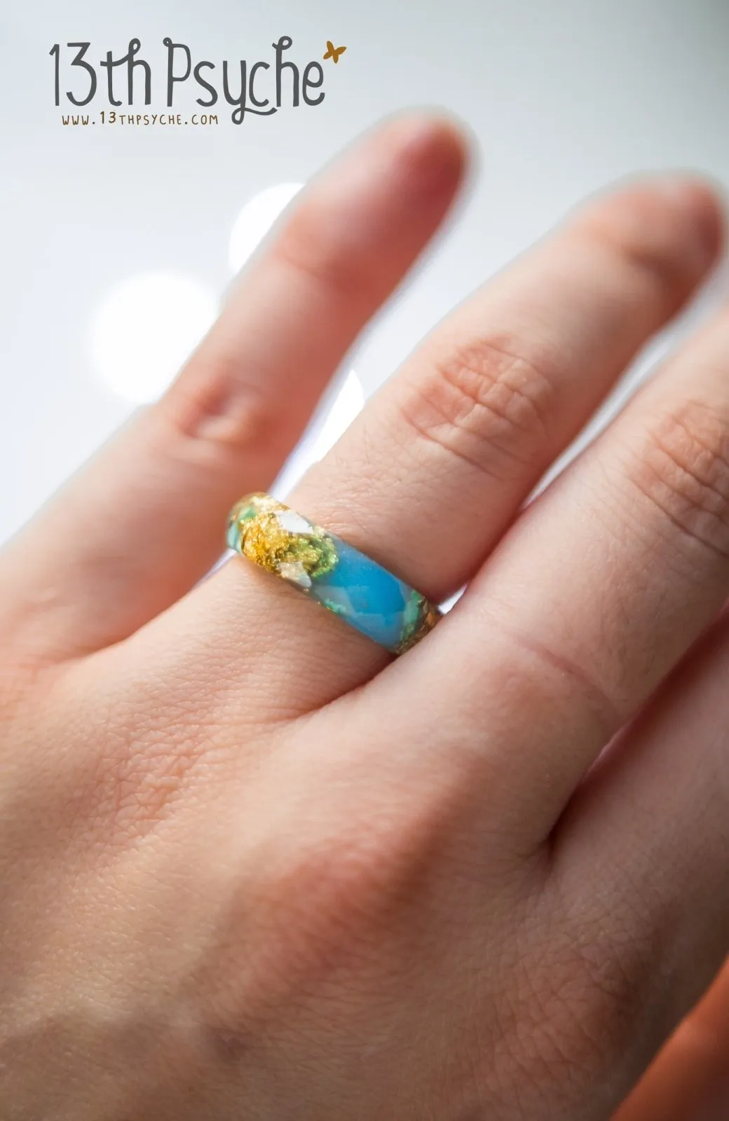 Light blue and gold flakes faceted resin ring